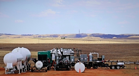 GTUIT System in operation in Bakken oil fields with tanker trucks for storage of natural gas liquids.